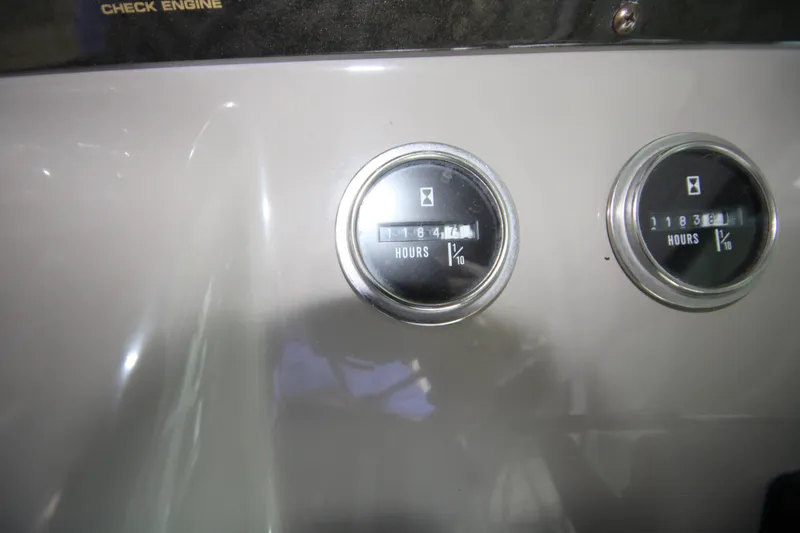 Slide: The Image of Hour meters on 2003 Cruisers Yachts 320 Express dashboard, displaying engine hours. - 15