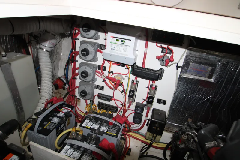 Slide: The Image of Electrical system of a 2003 Cruisers Yachts 320 Express, featuring batteries and wiring. - 28