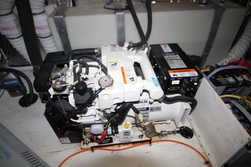 Slide: The Image of Engine room of 2003 Cruisers Yachts 320 Express with Kohler power system. - 29