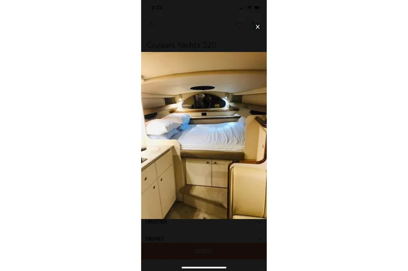 Slide: The Image of Interior cabin of 2003 Cruisers Yachts 320 Express, featuring a cozy bed and storage. - 32
