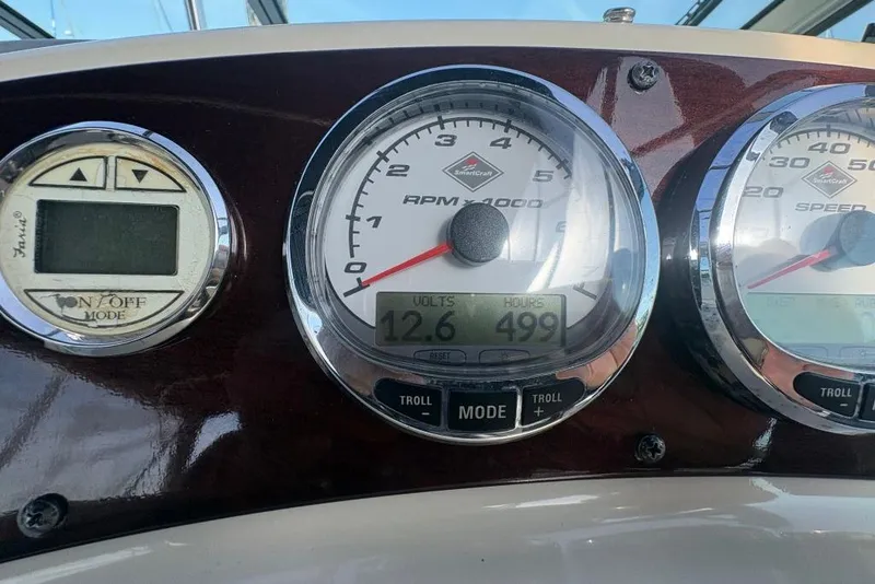Slide: The Image of Dashboard of a 2008 Maxum 2700 SE boat showing gauges and controls. - 26