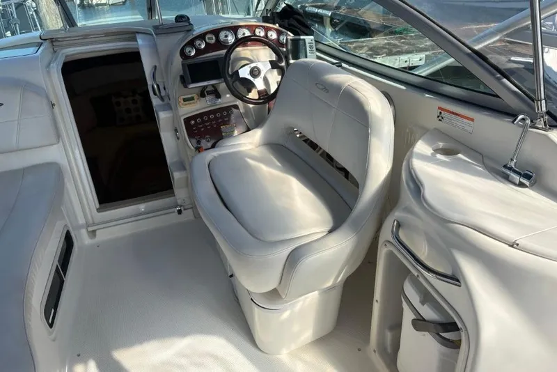 Slide: The Image of 2008 Maxum 2700 SE boat cockpit with steering wheel and control panel. - 27