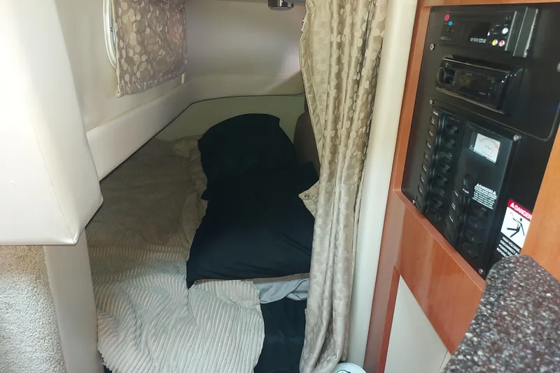Slide: The Image of Interior cabin of 2008 Maxum 2700 SE boat with cozy sleeping area. - 29
