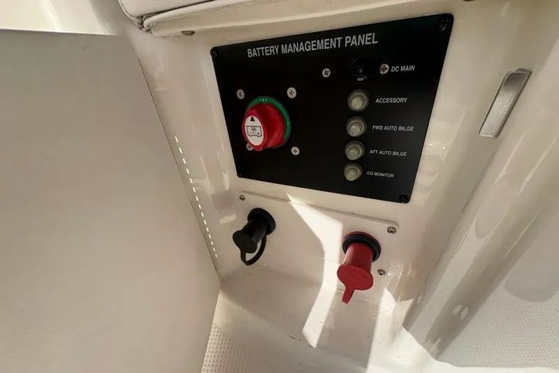 Slide: The Image of Battery management panel on 2008 Maxum 2700 SE boat, featuring various control switches. - 38