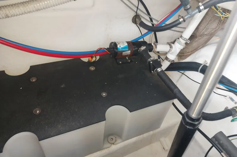 Slide: The Image of Engine compartment of a 2008 Maxum 2700 SE boat, showing wiring and plumbing components. - 42