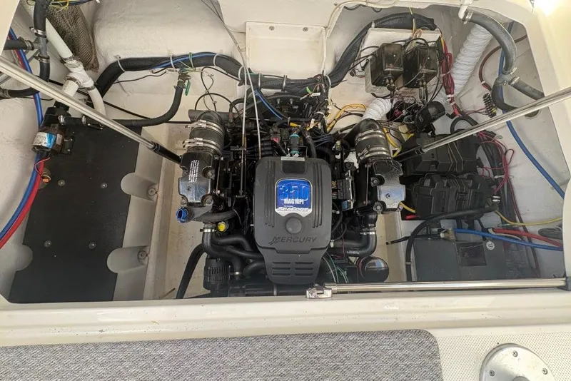 Slide: The Image of Engine compartment of a 2008 Maxum 2700 SE boat with Mercury engine. - 61