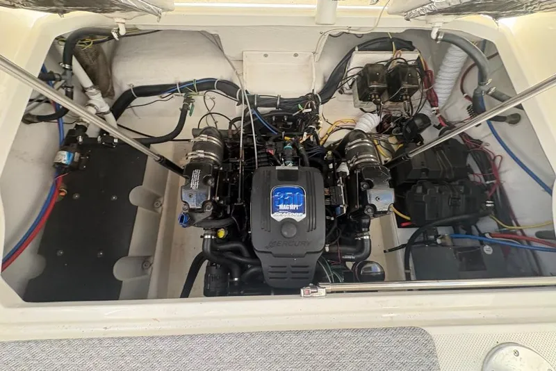 Slide: The Image of Engine compartment of a 2008 Maxum 2700 SE boat, featuring a MerCruiser engine. - 63