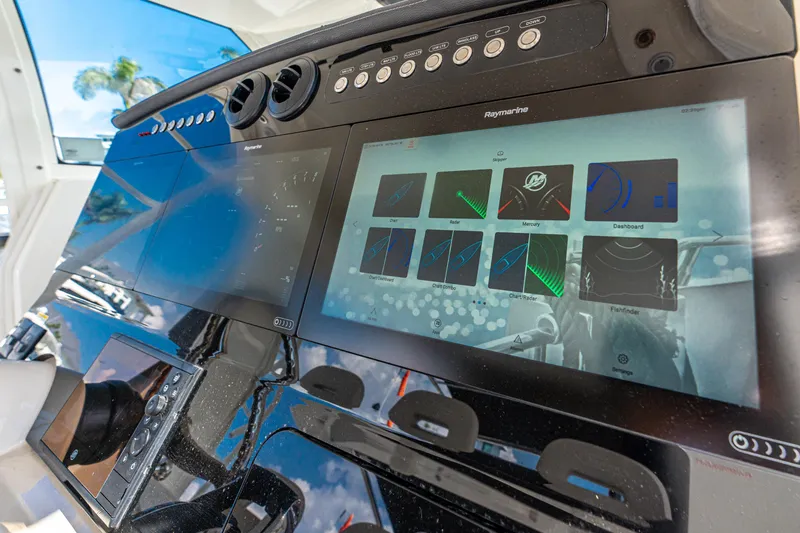 Slide: The Image of Control panel of 2019 Boston Whaler 420 Outrage with advanced navigation screens. - 20