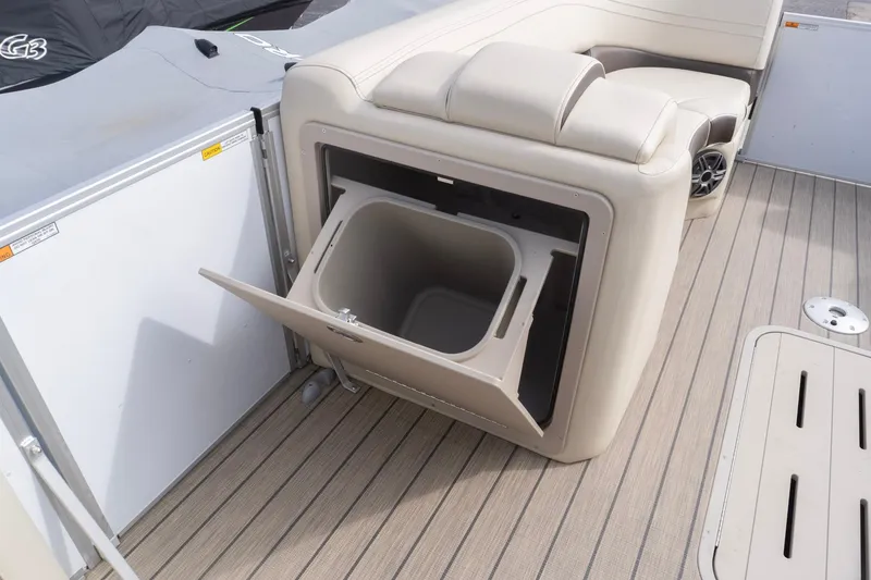 Slide: The Image of SunCatcher Fusion 324SL 2026 boat interior with open storage compartment on deck. - 15