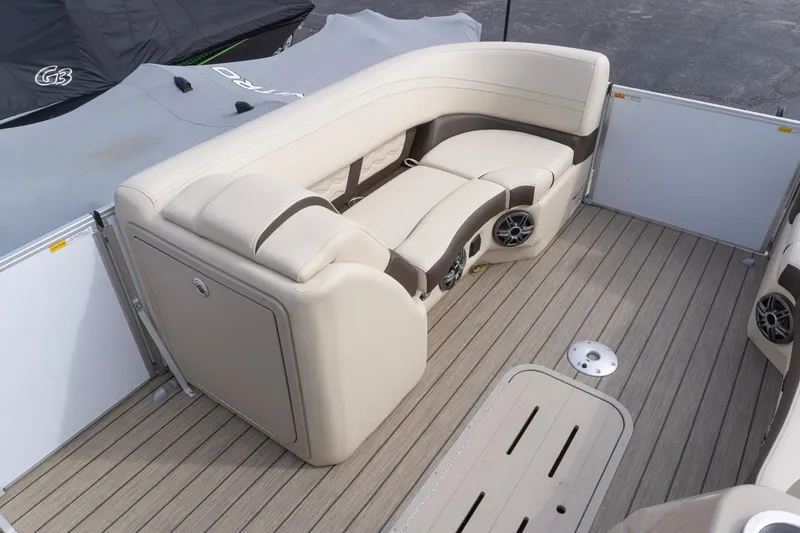 Slide: The Image of Luxurious seating area on 2026 SunCatcher Fusion 324SL boat with beige upholstery and wood flooring. - 16