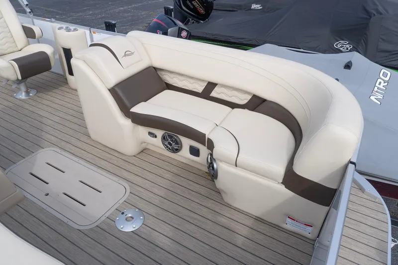 Slide: The Image of Luxurious seating on 2026 SunCatcher Fusion 324SL boat with beige and brown upholstery. - 18