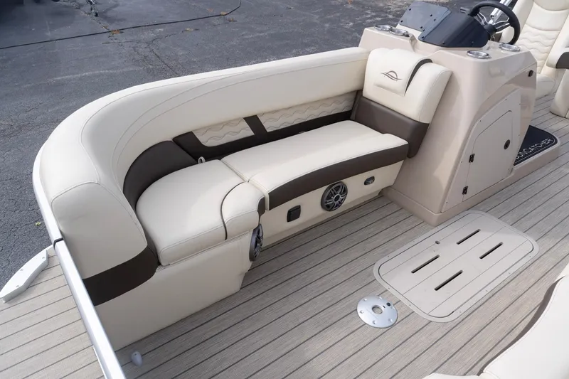 Slide: The Image of Luxurious seating on 2026 SunCatcher Fusion 324SL boat, featuring beige and brown upholstery. - 21