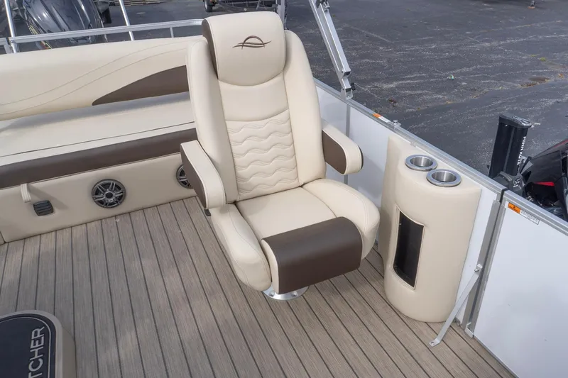 Slide: The Image of Luxurious seating on 2026 SunCatcher Fusion 324SL boat, featuring cup holders and elegant design. - 24