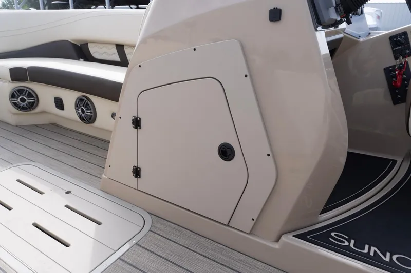 Slide: The Image of Interior of 2026 SunCatcher Fusion 324SL boat, featuring seating and storage compartment. - 26