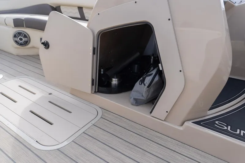 Slide: The Image of Open storage compartment on 2026 SunCatcher Fusion 324SL boat deck. - 27