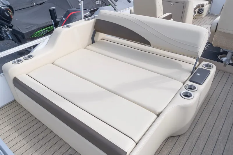 Slide: The Image of Luxurious seating on 2026 SunCatcher Fusion 324SL boat with cup holders and sleek design. - 5