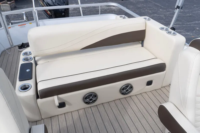Slide: The Image of Luxurious seating on 2026 SunCatcher Fusion 324SL boat with cup holders and speakers. - 7