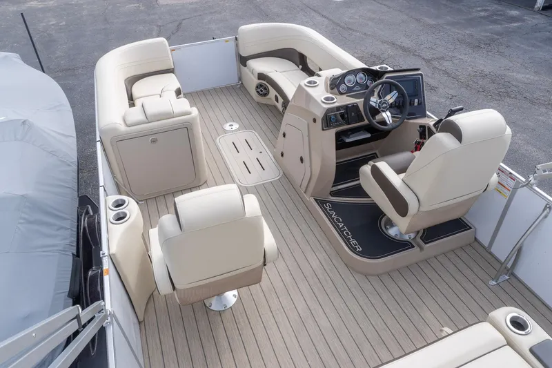 Slide: The Image of Luxurious 2026 SunCatcher Fusion 324SL pontoon boat interior with plush seating and modern helm. - 9