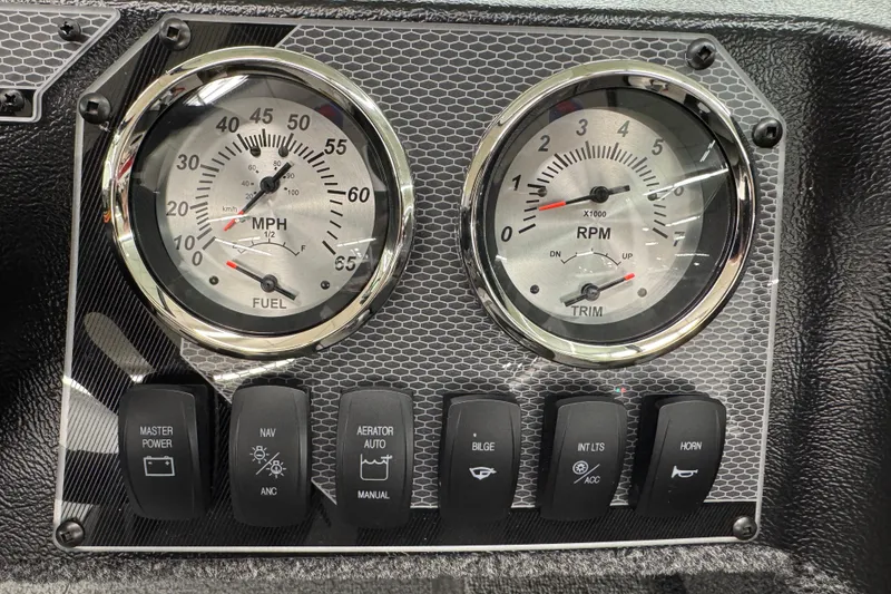 Slide: The Image of Dashboard of 2026 Lund 1650 Rebel XL Sport with gauges and control switches. - 13