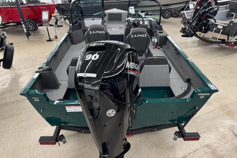 Slide: The Image of 2026 Lund 1650 Rebel XL Sport boat with Mercury 90 engine in showroom. - 4