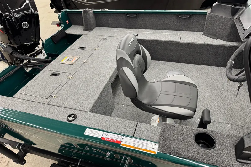Slide: The Image of 2026 Lund 1650 Rebel XL Sport boat interior with seating and storage compartments. - 7