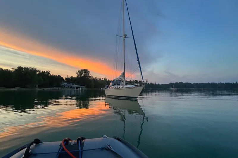 The Image of Sailboat on calm water at sunset, S2 11.0 meter A, 1985 model. - 1