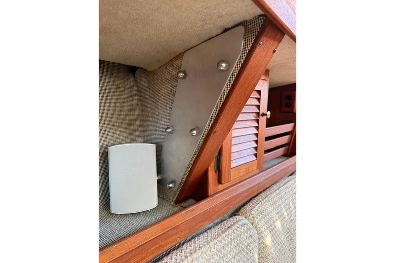 Slide: The Image of Interior of 1985 S2 11.0 meter A sailboat with wood paneling and speaker. - 18
