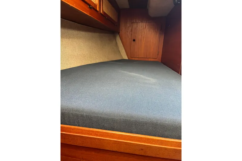Slide: The Image of Interior cabin of 1985 S2 11.0 meter A sailboat with blue cushion. - 28