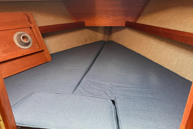Slide: The Image of Interior cabin of 1985 S2 11.0 meter A sailboat with blue cushions. - 30