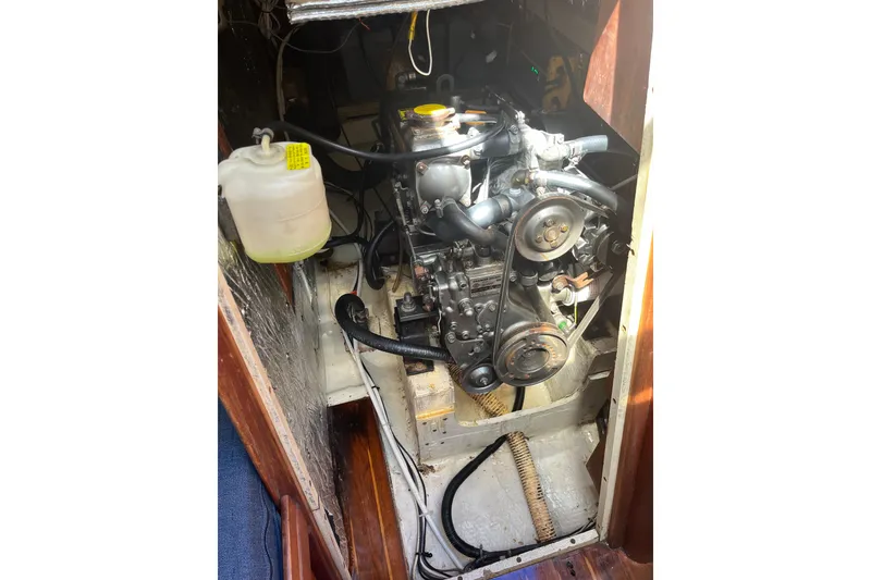 Slide: The Image of Engine compartment of a 1985 S2 11.0 meter A sailboat, showcasing mechanical components. - 32