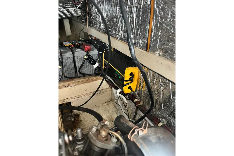 Slide: The Image of Battery and charger setup in 1985 S2 11.0 meter A sailboat engine compartment. - 34