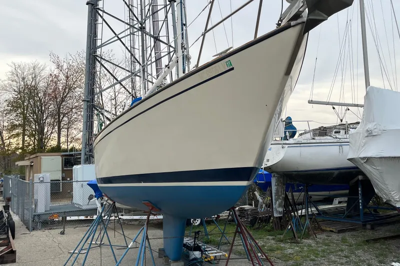 Slide: The Image of 1985 S2 11.0 meter A sailboat on stands in a boatyard. - 36