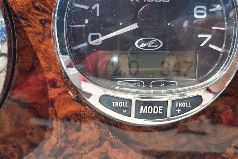 Slide: The Image of Close-up of 2005 Sea Ray 290 Amberjack dashboard gauge showing volts and hours. - 17