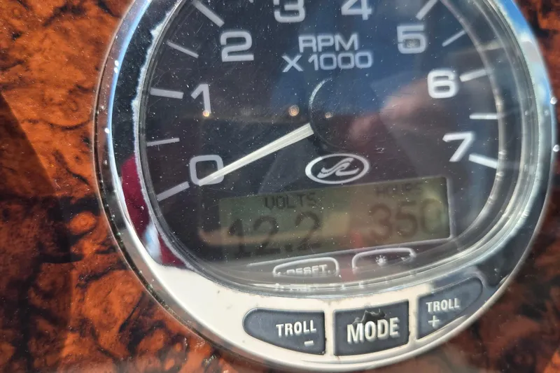 Slide: The Image of Close-up of 2005 Sea Ray 290 Amberjack tachometer displaying RPM and voltage. - 18