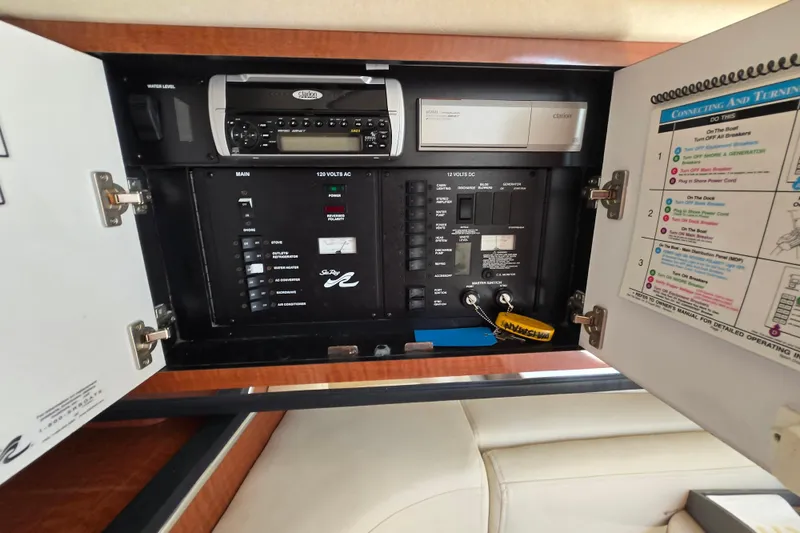 Slide: The Image of Electrical control panel inside a 2005 Sea Ray 290 Amberjack boat. - 21