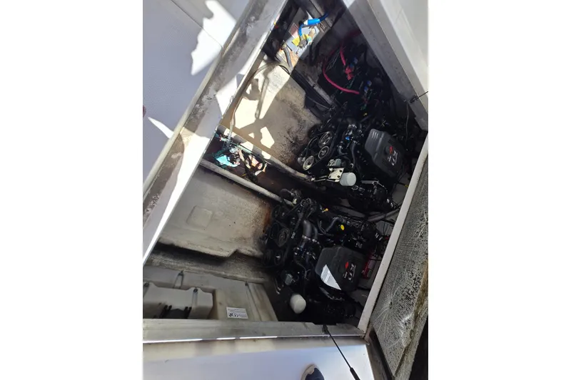 Slide: The Image of Engine compartment of a 2005 Sea Ray 290 Amberjack boat, showing dual engines. - 24