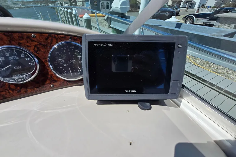 Slide: The Image of Garmin echomap 70dv on 2005 Sea Ray 290 Amberjack dashboard with gauges. - 25
