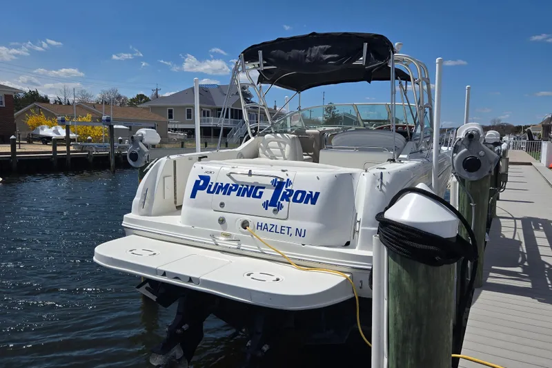 Slide: The Image of 2005 Sea Ray 290 Amberjack boat docked, named "Pumping Iron," in Hazlet, NJ. - 4