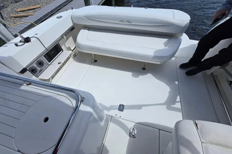 Slide: The Image of 2005 Sea Ray 290 Amberjack boat interior with white seating and control panel. - 9