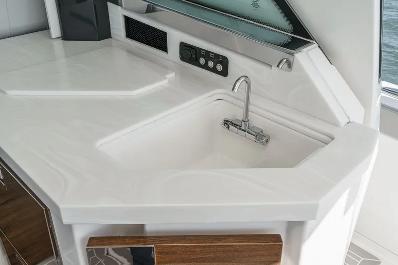 Slide: The Image of Luxurious kitchenette on the 2023 Tiara Yachts 48 LS. - 18