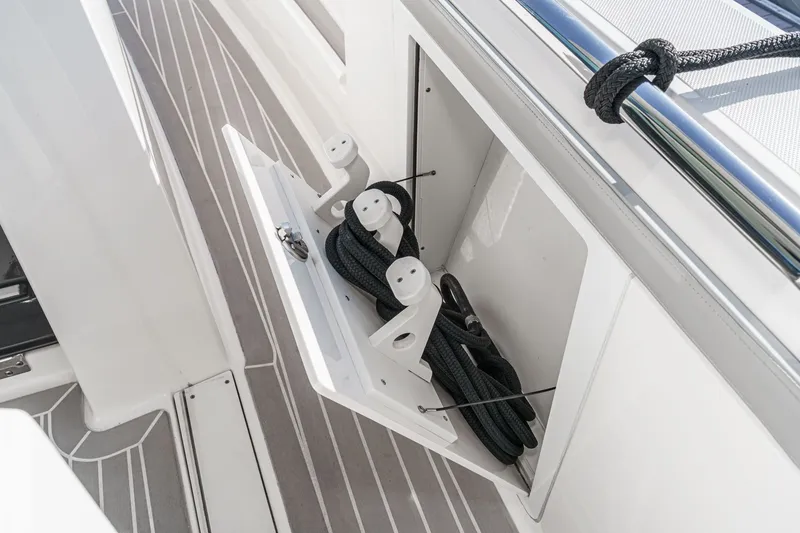 Slide: The Image of Storage compartment on 2023 Tiara Yachts 48 LS with ropes. - 28
