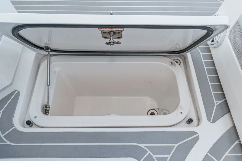 Slide: The Image of Open storage compartment on the 2023 Tiara Yachts 48 LS. - 31