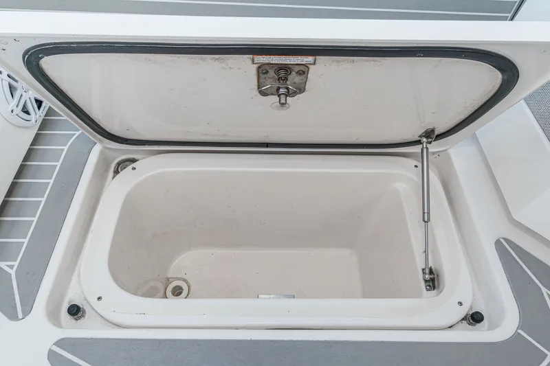 Slide: The Image of Open storage compartment on the 2023 Tiara Yachts 48 LS. - 32