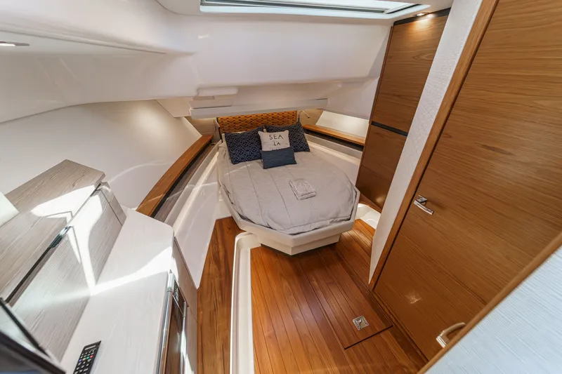 Slide: The Image of Interior of 2023 Tiara Yachts 48 LS featuring a luxurious bedroom. - 33
