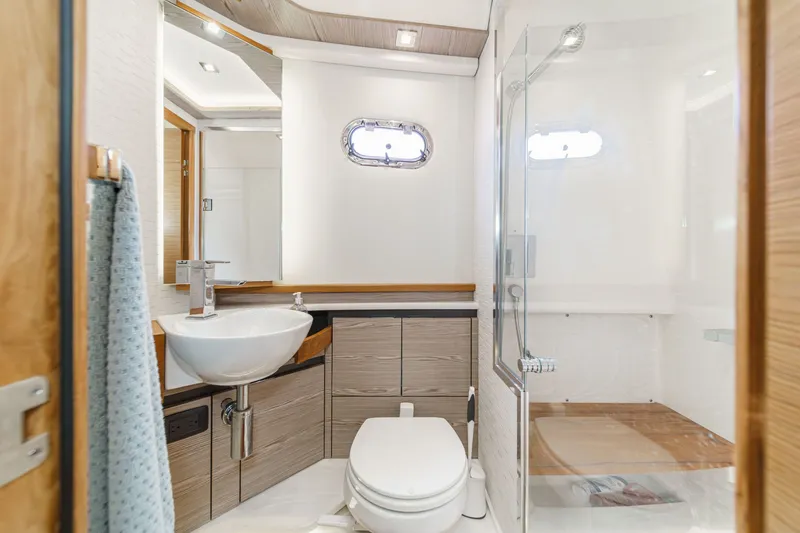 Slide: The Image of Luxurious bathroom on the 2023 Tiara Yachts 48 LS. - 37