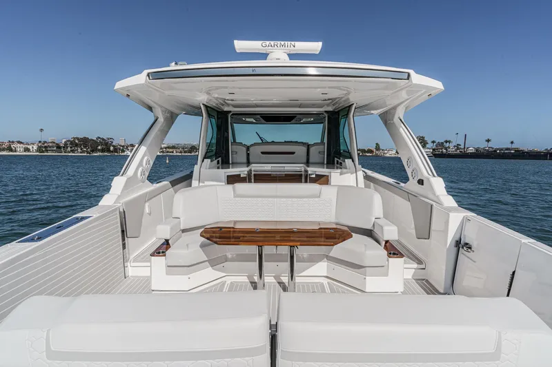 Slide: The Image of 2023 Tiara Yachts 48 LS with luxurious deck and seating area. - 5