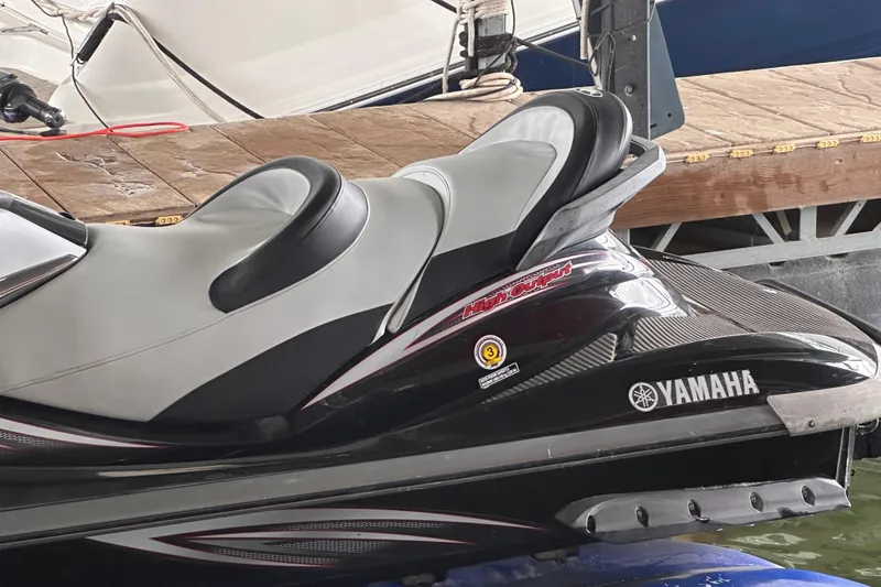 Slide: The Image of 2006 Yamaha WaveRunner FX Cruiser HO jet ski docked, featuring sleek design and comfortable seating. - 4