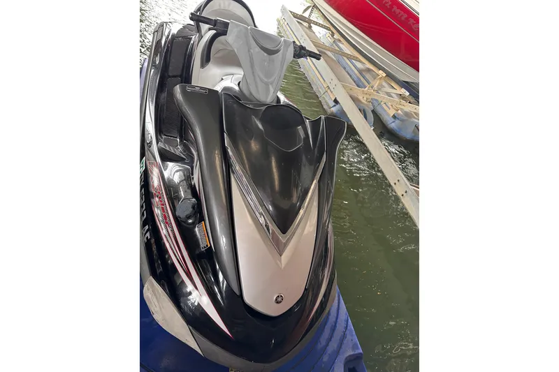 Slide: The Image of 2006 Yamaha WaveRunner FX Cruiser HO jet ski docked on water. - 7