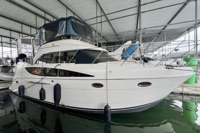 The Image of 2007 Meridian 368 Motoryacht docked in a covered marina. - 0