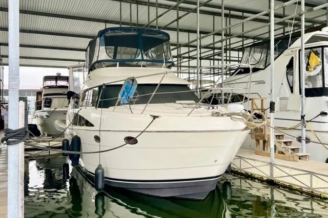 Slide: The Image of 2007 Meridian 368 Motoryacht docked in a covered marina slip. - 1